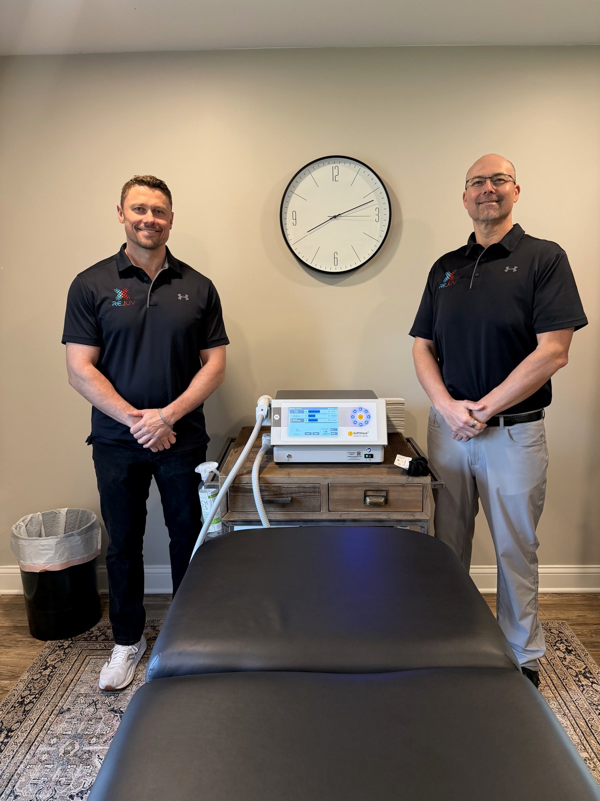 Co-founders Dr. Chad Schleiger and Dean Le Blanc standing with the SoftWave therapy machine at Rejuv Health