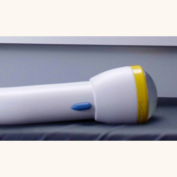 The SoftWave applicator wand with yellow tip